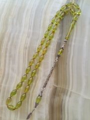 Özel İşçilikli Atölye Yapımı 925 Ayar Gümüş Püsküllü Ateş Kehribar Tesbih.Ürün Piyasanın en iyi Hammaddesinden Yapılmış Olup Canlı Rengiyle, Yumuşak Dokusu ve Kusursuz İşçiligiyle Tesbih Severlerin Beğenisine Sunulmuştur.