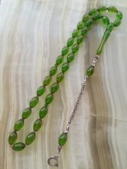 Özel İşçilikli Atölye Yapımı 925 Ayar Gümüş Püsküllü Ateş Kehribar Tesbih.Ürün Piyasanın en iyi Hammaddesinden Yapılmış Olup Canlı Rengiyle, Yumuşak Dokusu ve Kusursuz İşçiligiyle Tesbih Severlerin Beğenisine Sunulmuştur.