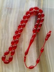 Özel İşçilikli Atölye Yapımı Ateş Kehribar Tesbih.Ürün Piyasanın en iyi Hammaddesinden Yapılmış Olup Canlı Rengiyle, Yumuşak Dokusu ve Kusursuz İşçiligiyle Tesbih Severlerin Beğenisine Sunulmuştur.