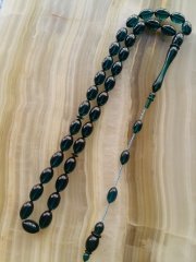 Özel İşçilikli Atölye Yapımı Ateş Kehribar Tesbih.Ürün Piyasanın en iyi Hammaddesinden Yapılmış Olup Canlı Rengiyle, Yumuşak Dokusu ve Kusursuz İşçiligiyle Tesbih Severlerin Beğenisine Sunulmuştur.