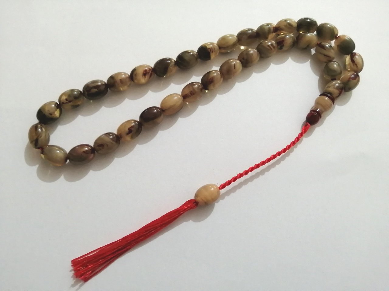 İp Püsküllü Yumurta Kesim Hareli Sıkma Kehribar Tesbih