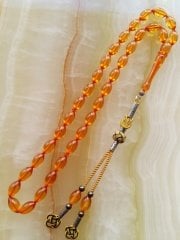 Kazaz Püsküllü Elde Yağ Gibi Çekimi Olan Birinci Sınıf Malzemeden Yapılmış Ateş Kehribar Tesbihimiz Tesbih Severlerin Beğenisine Sunulmuştur