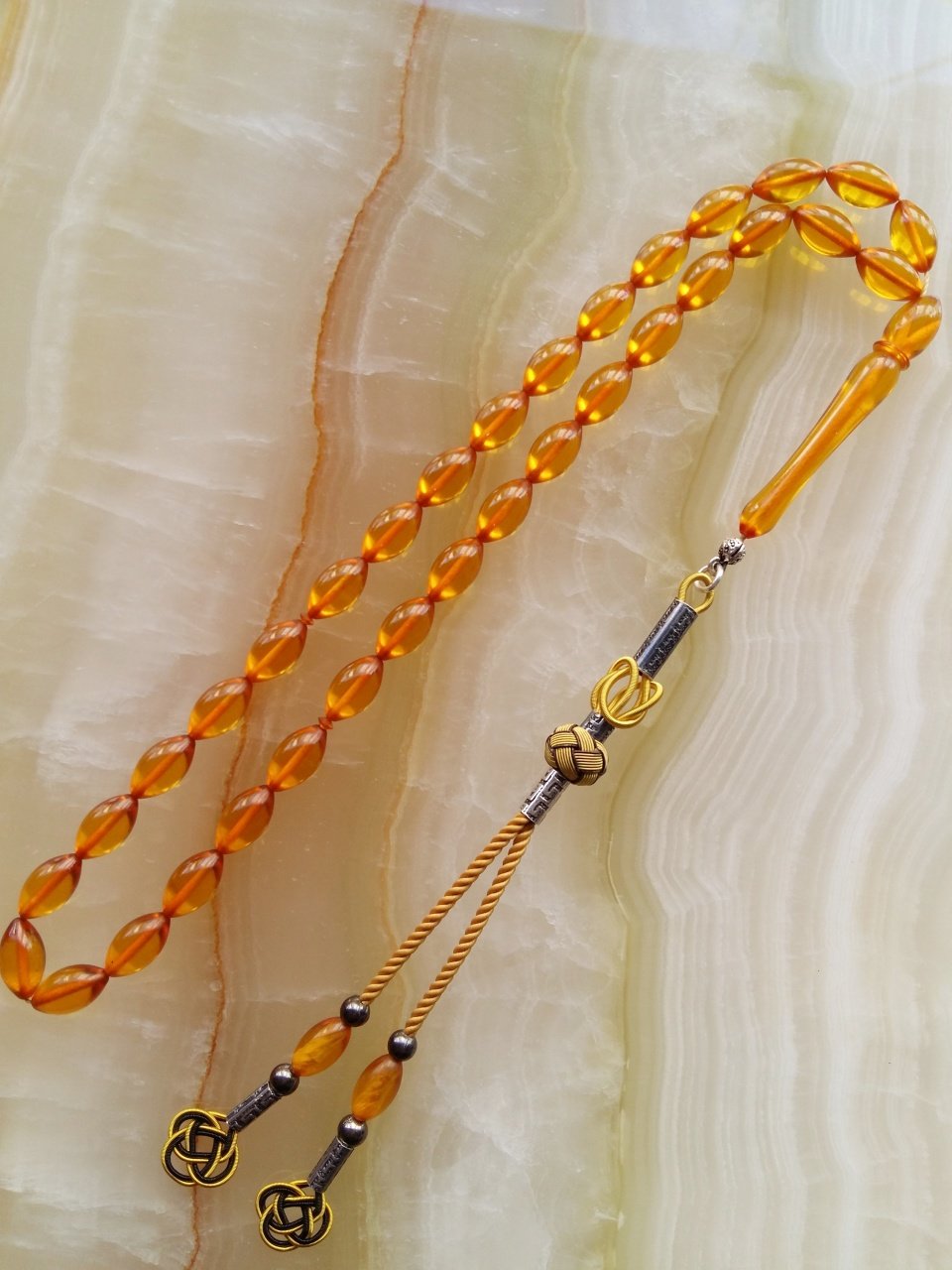 Kazaz Püsküllü Elde Yağ Gibi Çekimi Olan Birinci Kalite Malzemeden Yapılmış Ateş Kehribar Tesbih