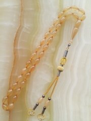 Kazaz Püsküllü Elde Yağ Gibi Çekimi Olan Birinci Kalite Malzemeden Yapılmış Beyzi Kesim Sıkma Kehribar Tesbih