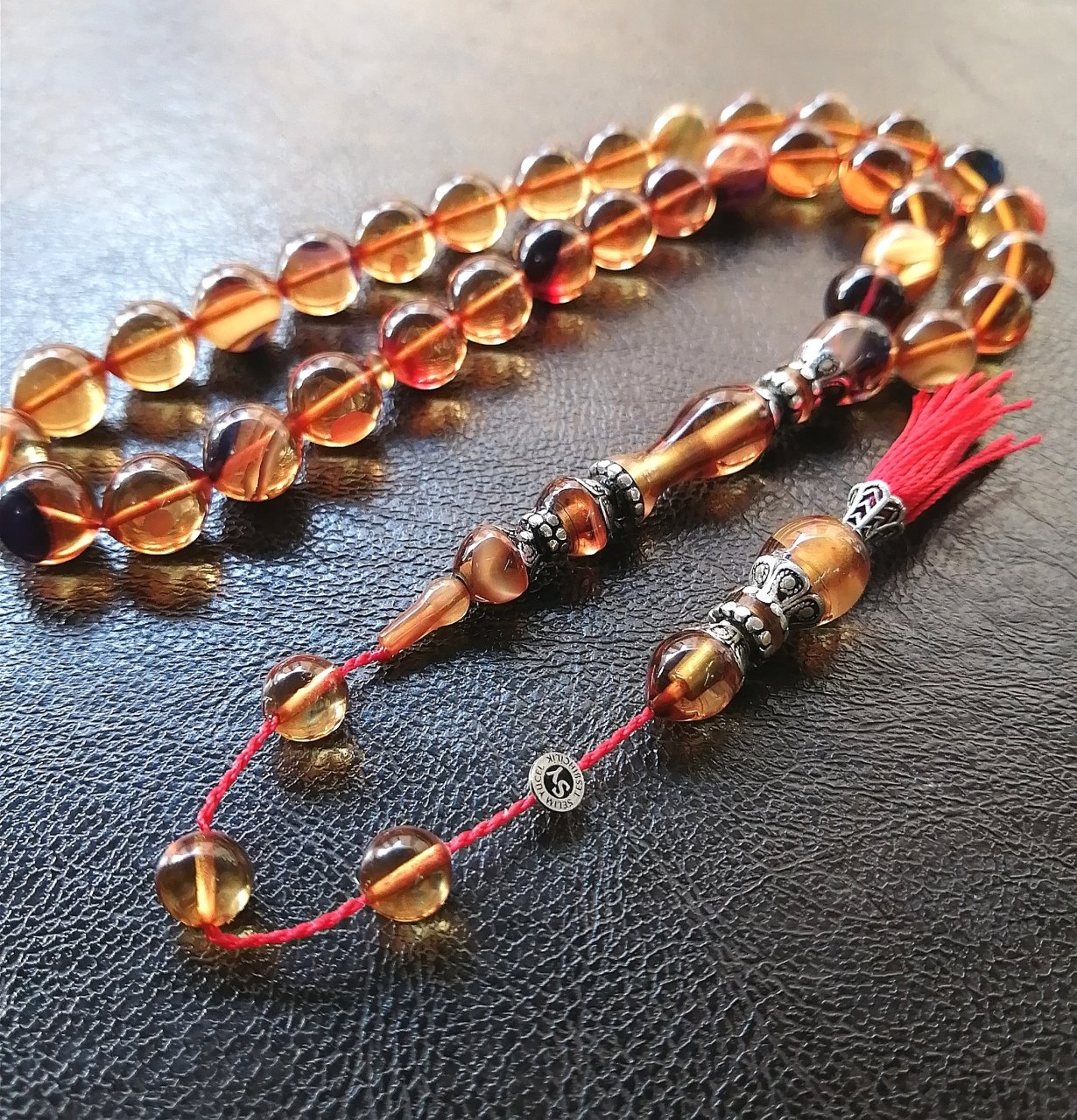 İmamesi 925 Ayar Gümüş İşçilikli Tombul Beyzi Kesim Sıkma Kehribar Tesbih