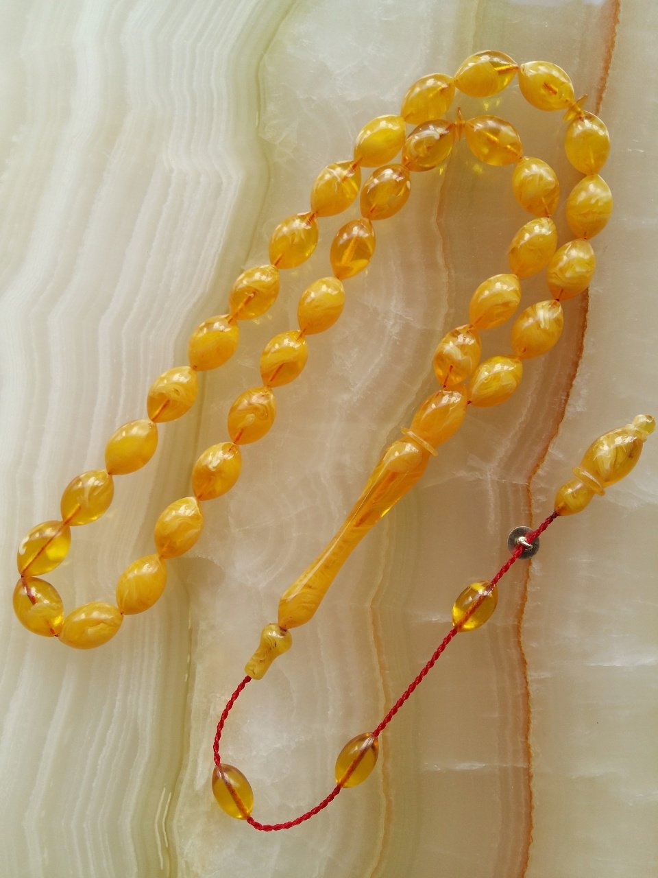 Piyasanın en iyi Hammadesinden Yapılmış Sistemli Özel İşçilikli Kolleksiyonluk Beyzi Kesim Sıkma Kehribar Tesbih