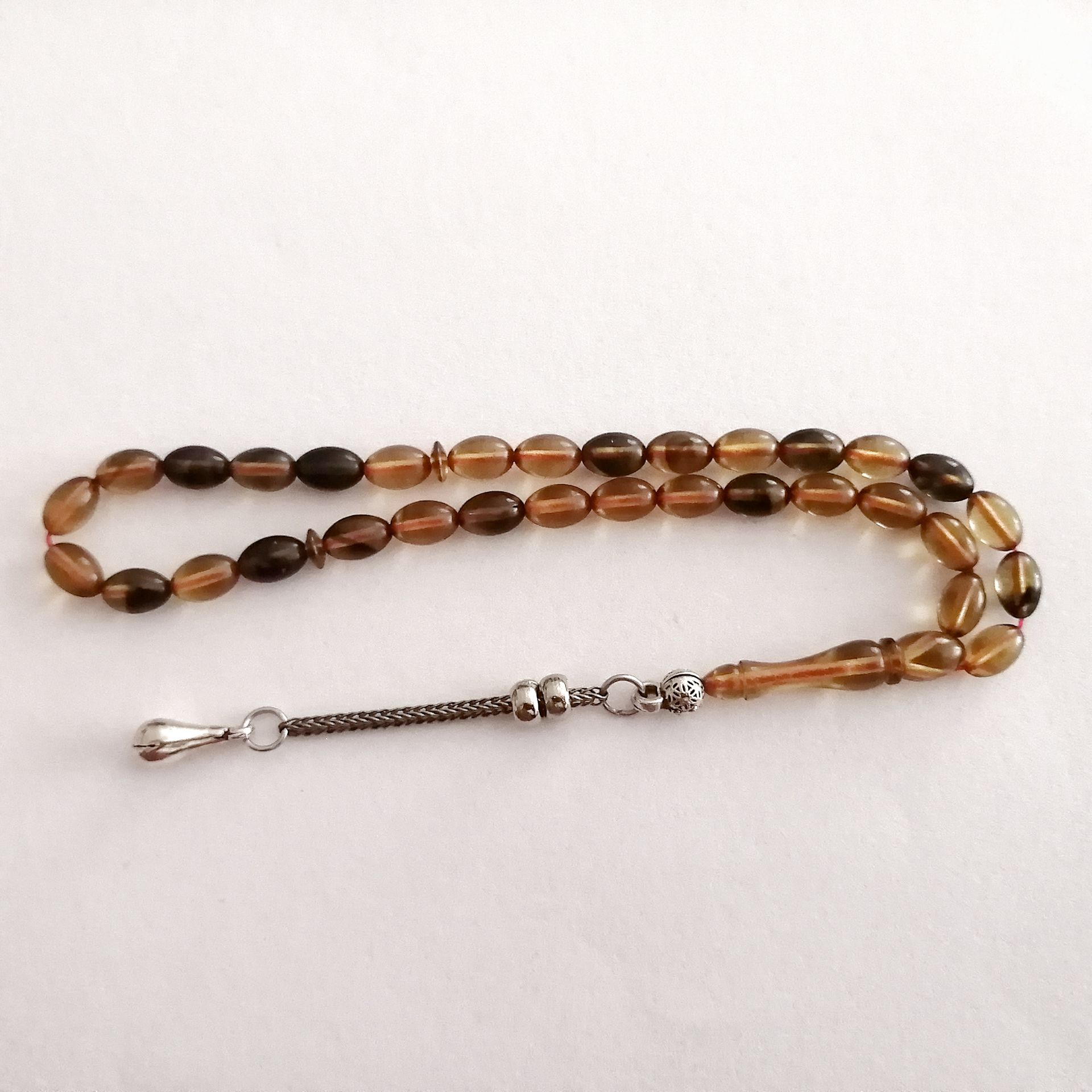 Alpaka Püsküllü Beyzi Kesim Sıkma Kehribar Tesbih