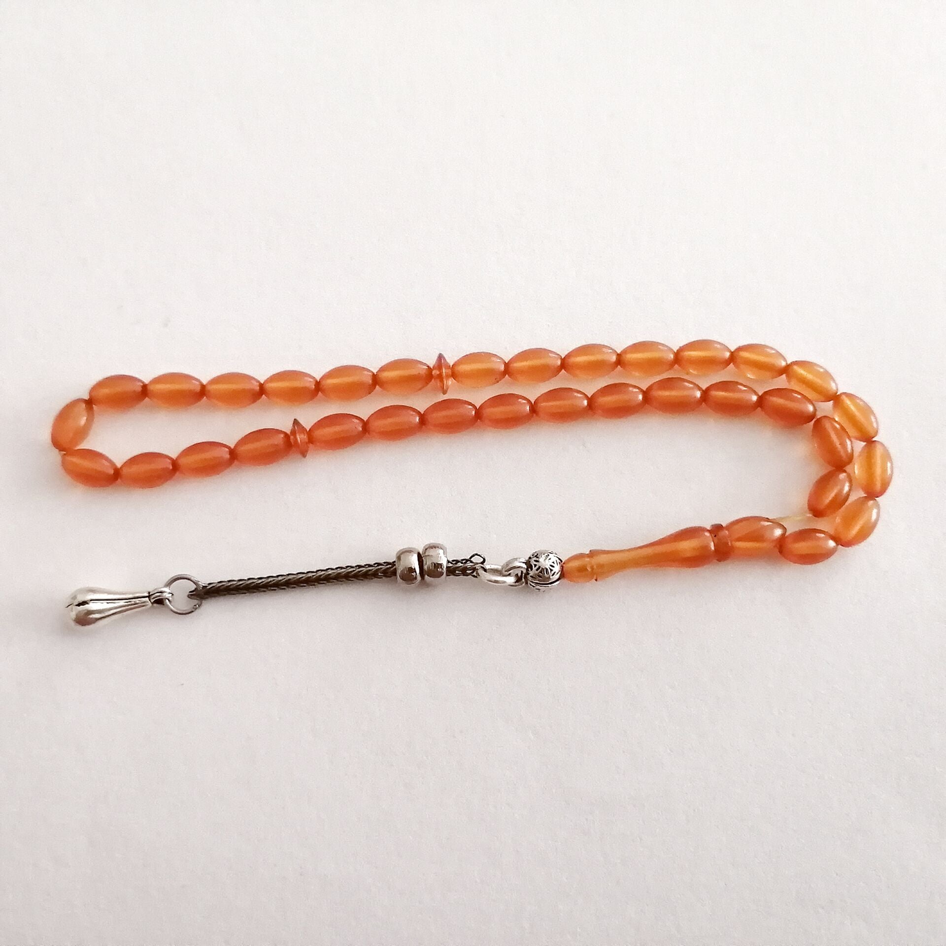 Alpaka Püsküllü Beyzi Kesim Sıkma Kehribar Tesbih