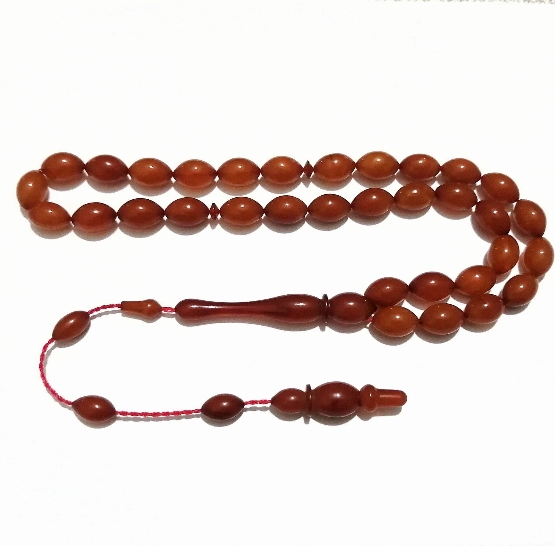 Sistem Püsküllü Beyzi Kesim Sıkma Kehribar Tesbih