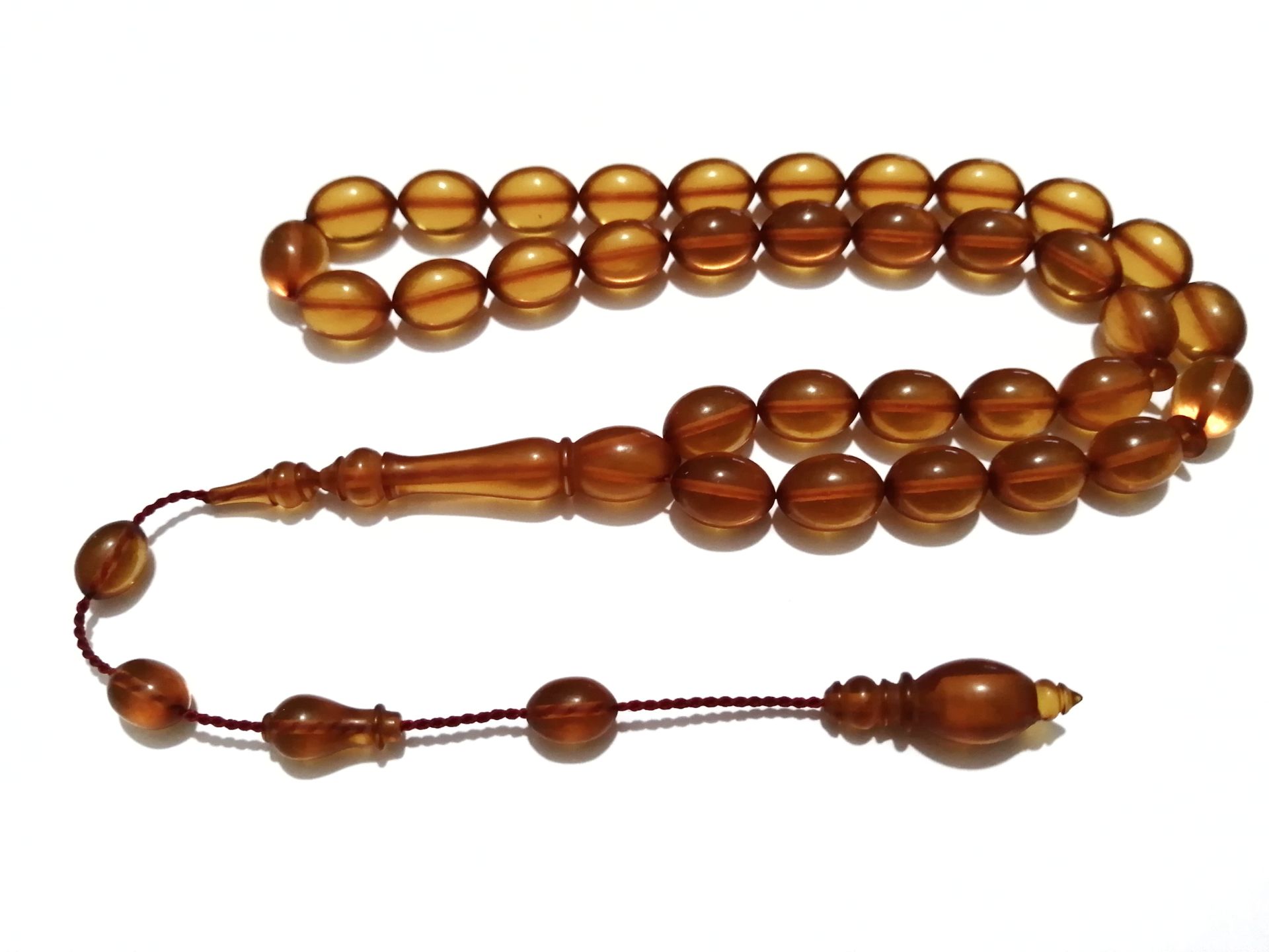 Sistem Püsküllü Beyzi Kesim Bal Rengi Ateş Kehribar Tesbih