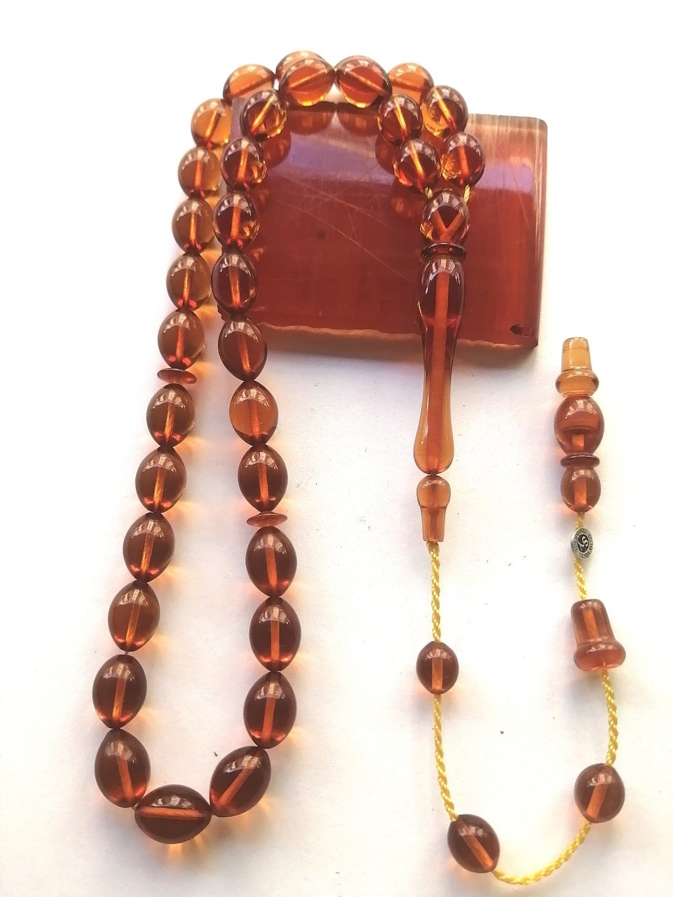 Özel İşçilikli Beyzi Kesim İmzalı & Sikkeli Sistem Püsküllü Ateş Kehribar Tesbih