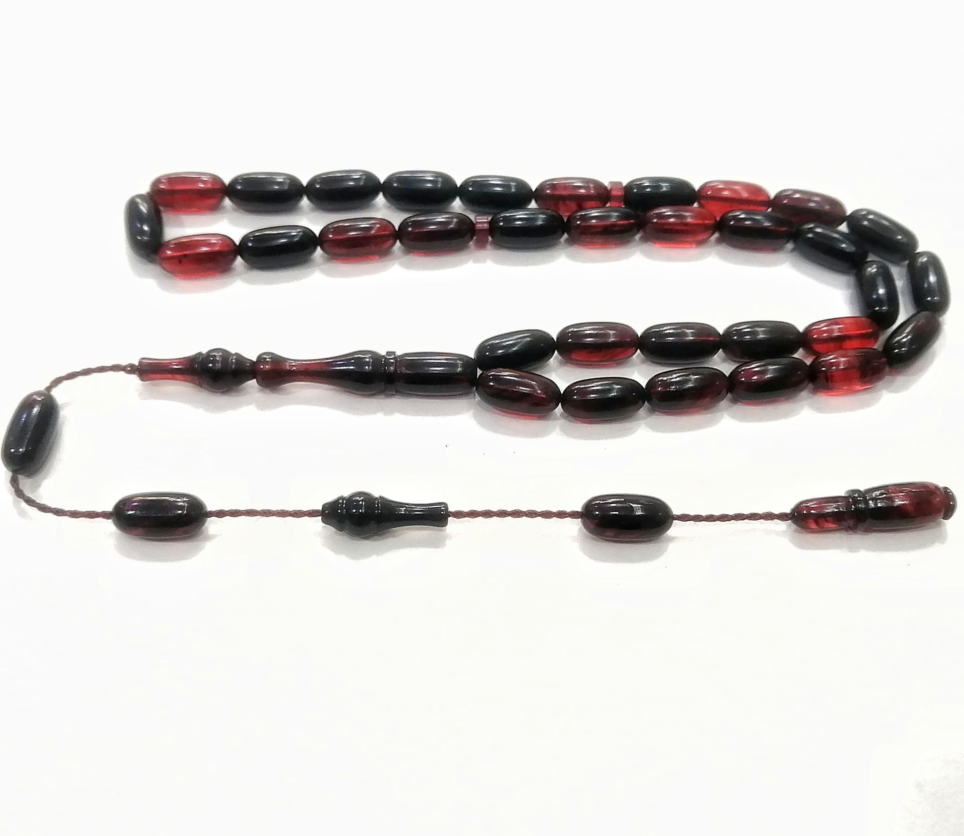 Sistem Püsküllü Şenalp Model Kırmızı Siyah Sıkma Kehribar Tesbih