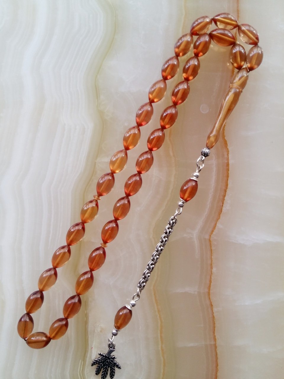 925 Ayar Gümüş Püsküllü Özel İşçilikli Atölye Yapımı Beyzi Kesim Ateş Kehribar Tesbih