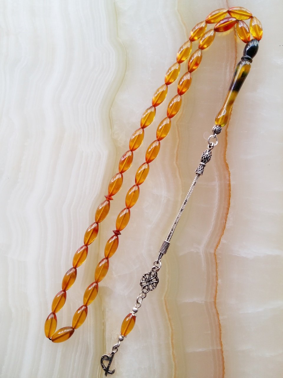 925 Ayar Gümüş Püsküllü Özel İşçilikli Atölye Yapımı Beyzi Kesim Ateş Kehribar Tesbih