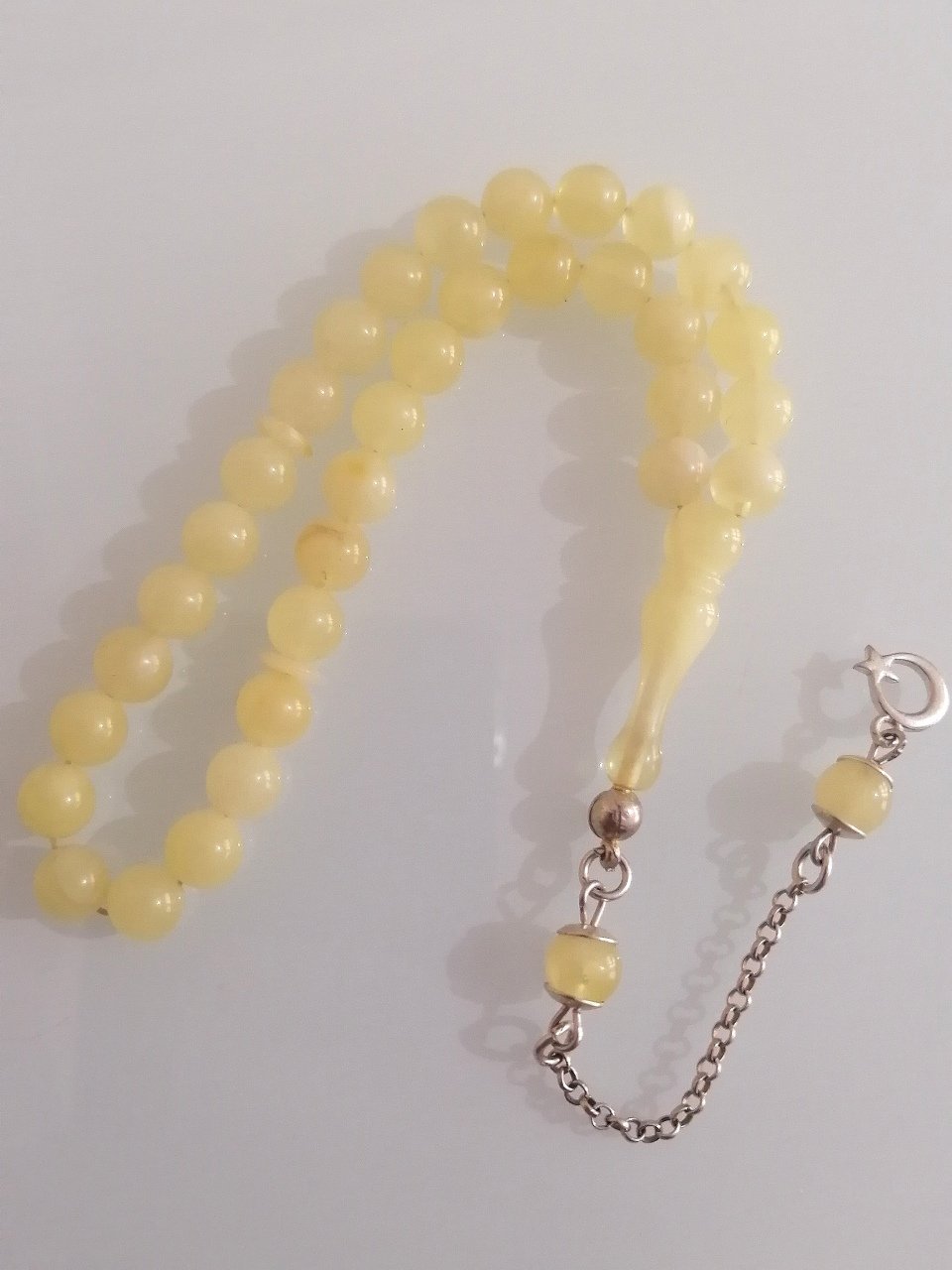 925 Ayar Gümüş Püsküllü Minik Boy Küre Kesim Mat Doğal Damla Kehribar Tesbihimiz Toptan Fiyatına Türkiyenin Online Toptan Tesbih Satış Sitesi toptantesbih.com da Beğeninize Sunulmuştur